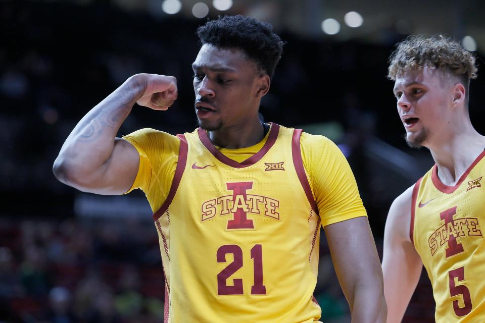 PORTLAND, OREGON - NOVEMBER 24: Osun Osunniyi #21 of the Iowa State Cyclones reacts after scoring a basket and drawing the foul during the first half against the Villanova Wildcats at Moda Center on November 24, 2022 in Portland, Oregon. (Photo by Soobum Im/Getty Images)