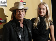 Actor Mickey Rourke arrives with model Elena Kuletskaya (R) at The Weinstein Company's Golden Globes after party after the 67th annual Golden Globe Awards in Beverly Hills, California January 17, 2010. REUTERS/Danny Moloshok (GOLDENGLOBES-PARTIES) (UNITED STATES - Tags: ENTERTAINMENT)