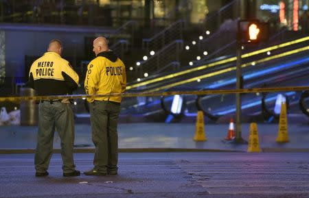 Las Vegas police investigate following a traffic crash in front of the Planet Hollywood Hotel, near the hotel and casino where the Miss Universe pageant was being held, in Las Vegas, Nevada December 20, 2015. REUTERS/David Becker