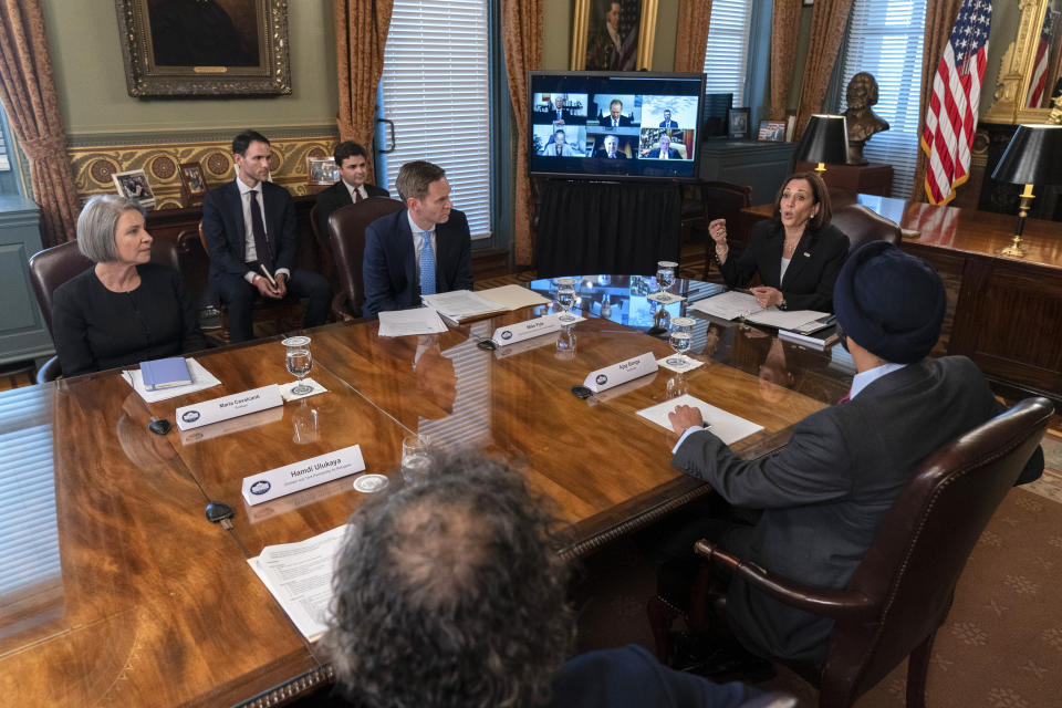 Vice President Kamala Harris attends a meeting with business CEO's about economic development in the Northern Triangle, Thursday, May 27, 2021, from her ceremonial office on the White House complex in Washington. Clockwise from left, Maria Cavalcanti, CEO of ProMujer, Chief Economic Adviser to the Vice President Michael Pyle, Harris, Ajay Banga, Chairman of Mastercard, and Hamdi Ulukaya, CEO of Chobani and Founder of the non-profit Tent Partnership. (AP Photo/Jacquelyn Martin)