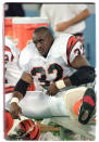 FILE - Cincinnati Bengals running back Ki-Jana Carter sits on the bench with his left knee iced after getting injured on his third carry of the game against the Detroit Lions during his NFL debut Thursday, Aug. 17, 1995, in Pontiac, Mich. The Bengals went with Ohio State defensive tackle Dan Wilkinson and Penn State running back Carter in consecutive years, drafting both over future Hall of Famers (running back Marshall Faulk in 1994; left tackle Tony Boselli in 1995). (AP Photo/Duane Burleson, File)