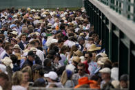 Fans stand at betting windows in the infield before the 148th running of the Kentucky Derby horse race at Churchill Downs Saturday, May 7, 2022, in Louisville, Ky. (AP Photo/Brynn Anderson)