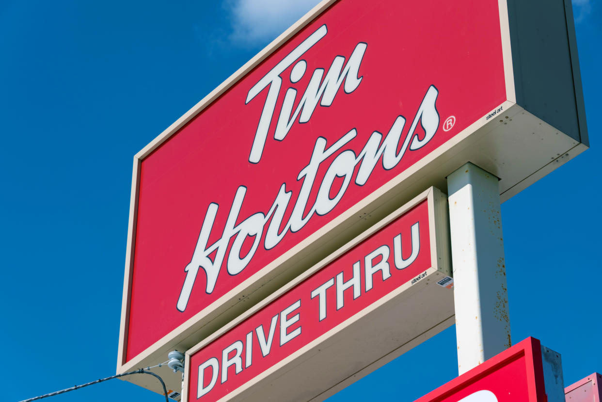 Tim Hortons drive through sign: Restaurant Brands' donut chain is known all over Canada for serving hot and delicious coffee and donuts. (Photo by Roberto Machado Noa/LightRocket via Getty Images)