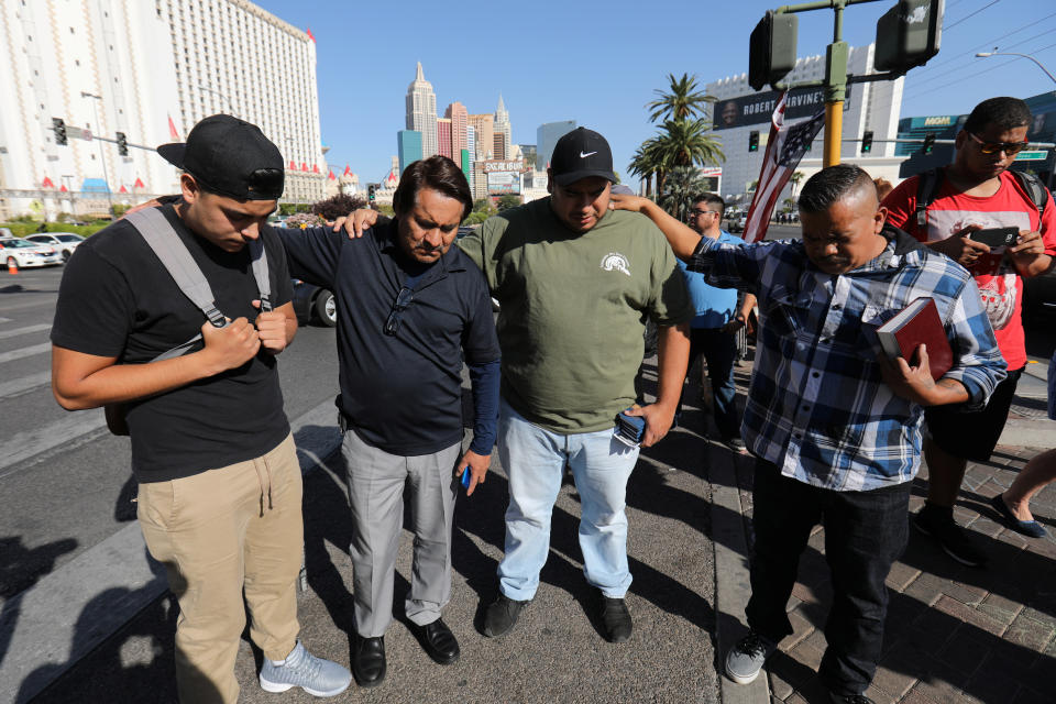 A group of men pray at a makeshift memorial in the middle of Las Vegas Boulevard following the mass shooting in Las Vegas, Nevada, U.S., October 4, 2017.&nbsp; (Photo: Mike Blake / Reuters)