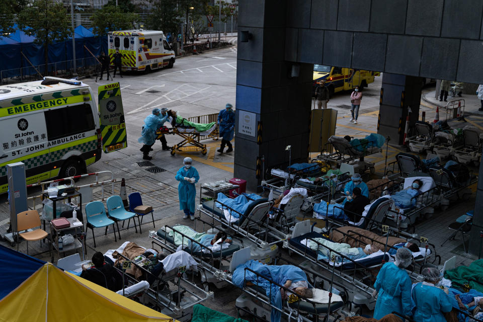 Patients lie in a temporary holding area outside Caritas Medical Center in Hong Kong on Feb. 16, 2022.<span class="copyright">Leung Man Hei—NurPhoto/Reuters</span>