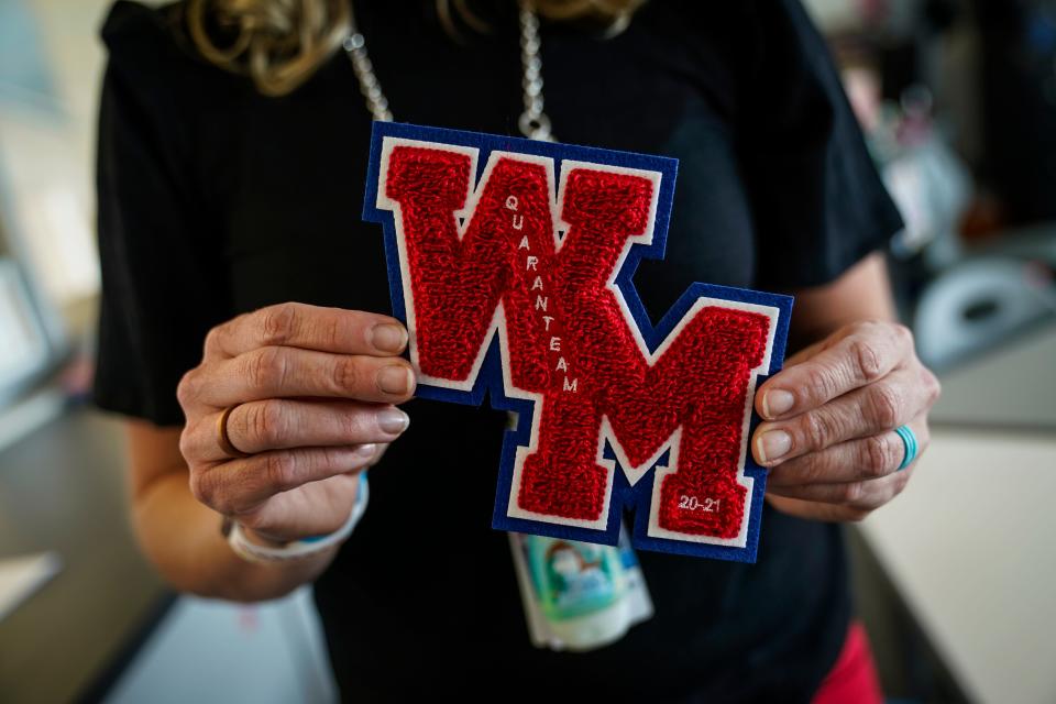 Stephanie Davy holds a specially designed West Mesa varsity letter patch, to recognize the strange 2020 year for student-athletes.