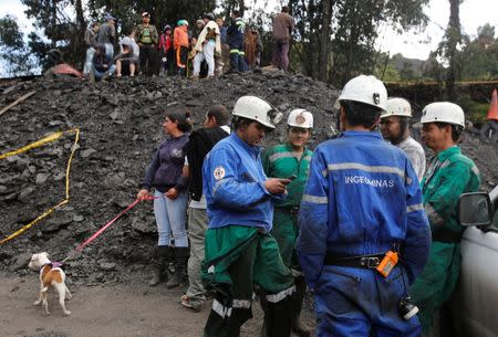 Rescue personnel coordinate to search for missing miners after an explosion at an underground coal mine on Friday, in Cucunuba, Colombia June 24, 2017. REUTERS/Jaime Saldarriaga