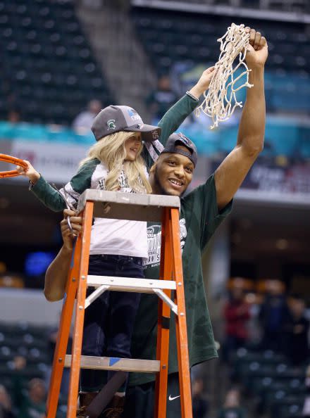 Adreian Payne #5 of the Michigan State Spartans celebrates with 8 year old Lacey Hullsworth after the 69-55 win over the Michigan Wolverines  during the finals of the Big Ten Basketball Tournament at Bankers Life Fieldhouse on March 16, 2014 in Indianapolis, Indiana.  (Photo by Andy Lyons/Getty Images)