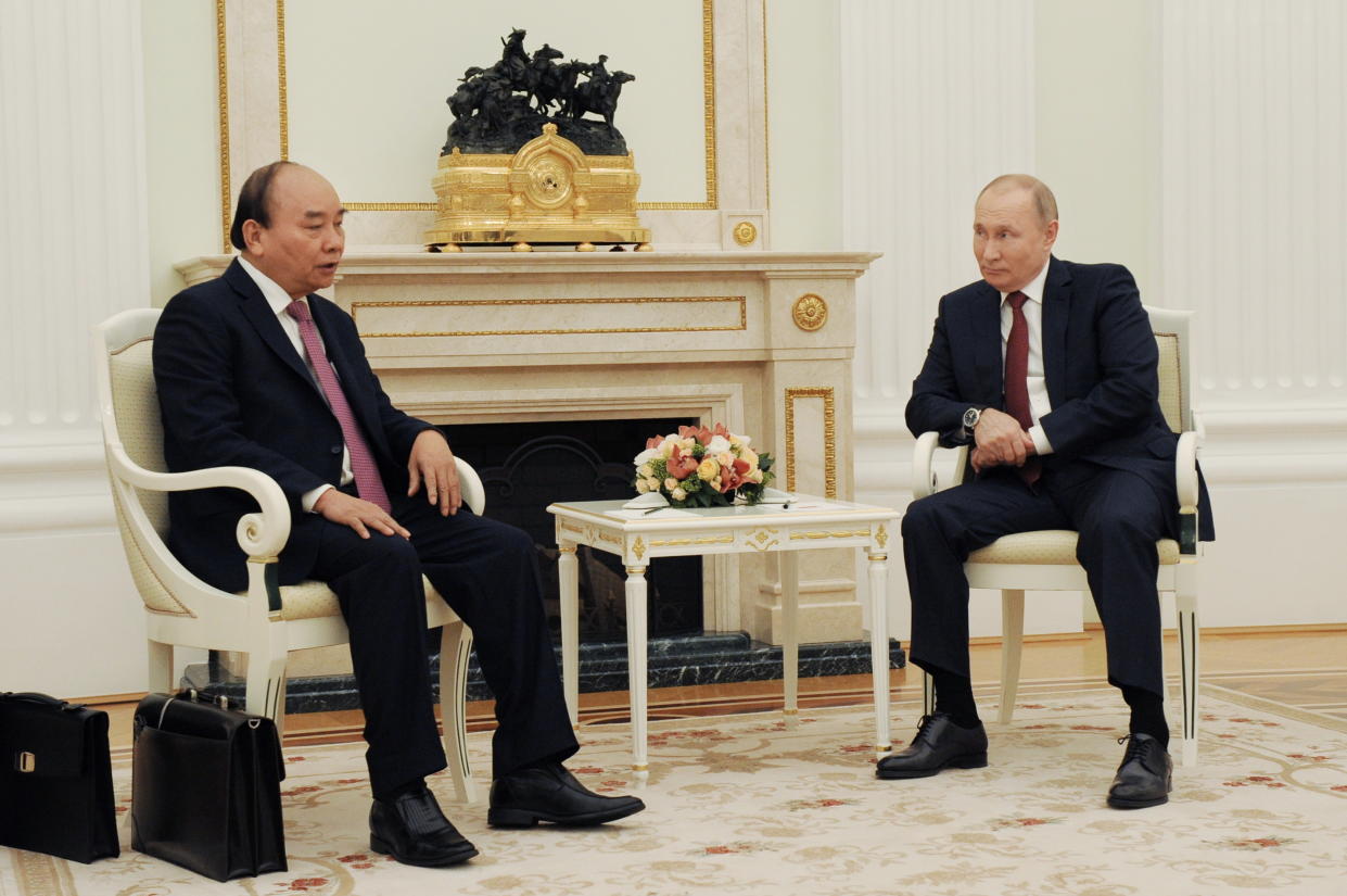 Russia's President Vladimir Putin listens to Vietnam's President Nguyen Xuan Phuc during a meeting in Moscow, Russia November 30, 2021. Sputnik/Mikhail Klimentyev/Kremlin via REUTERS ATTENTION EDITORS - THIS IMAGE WAS PROVIDED BY A THIRD PARTY.