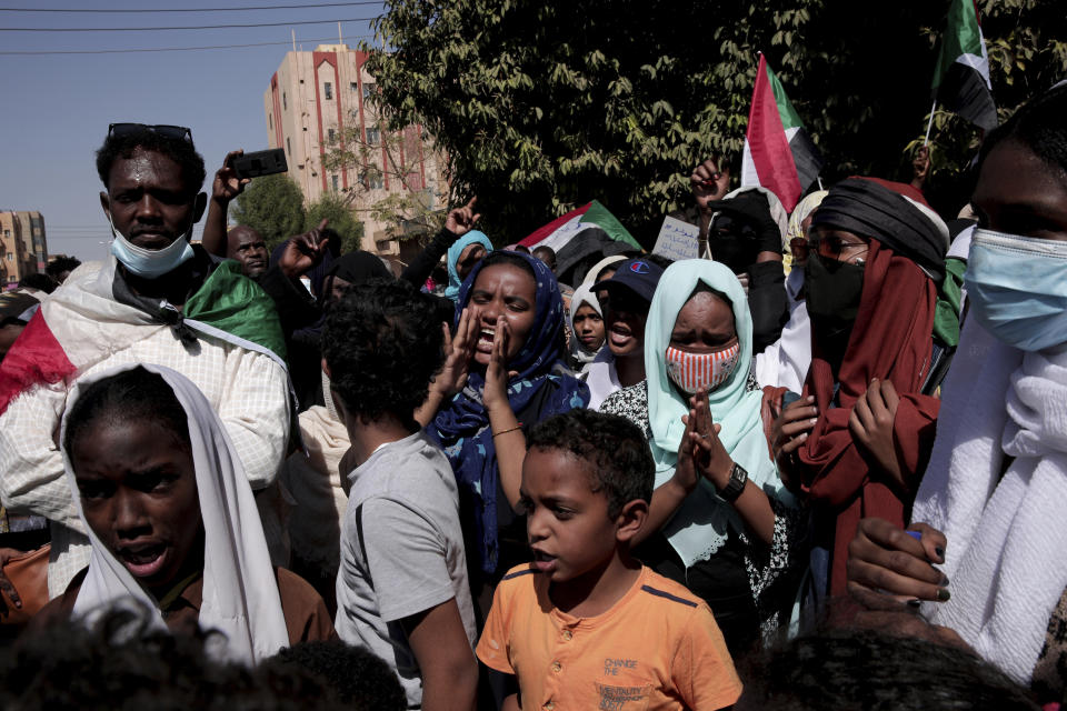 People chant slogans during a protest to denounce the October 2021 military coup, in Khartoum, Sudan, Thursday, Jan. 6, 2022. Sudanese took to the streets in the capital, Khartoum, and other cities on Thursday in anti-coup protests as the country plunged further into turmoil following the resignation of the prime minister earlier this week. (AP Photo/Marwan Ali)