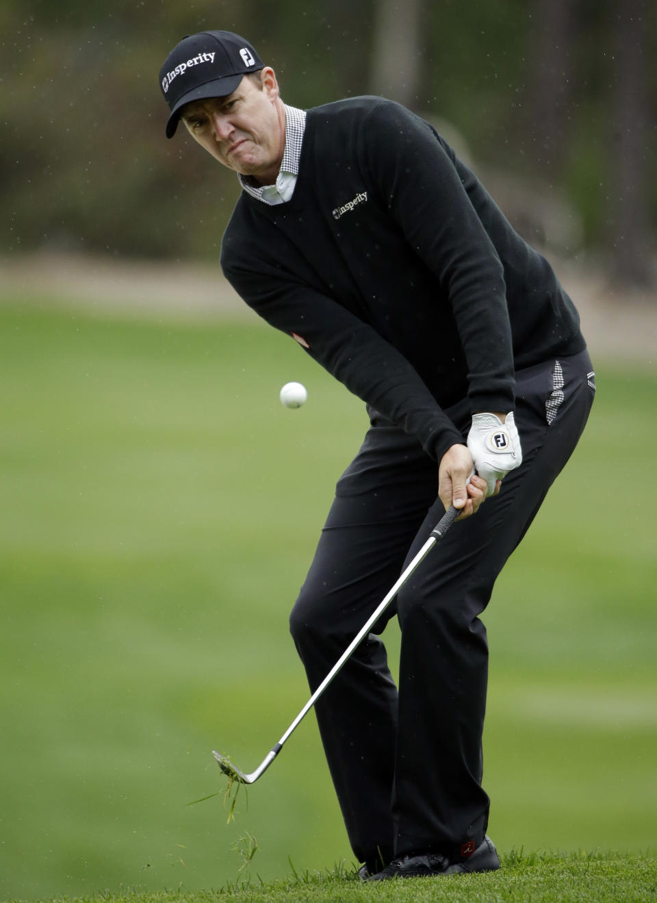 Jimmy Walker chips onto the sixth green on Friday, Feb. 7, 2014, during the second round of the AT&T Pebble Beach Pro-Am golf tournament on the Spyglass Hill Golf Course in Pebble Beach, Calif. (AP Photo/Ben Margot)