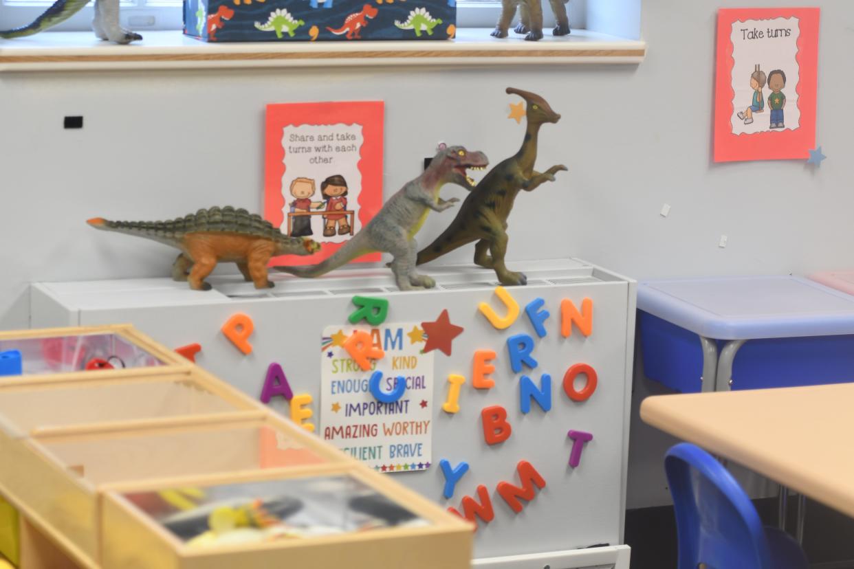 An assortment of dinosaur toys inside the Life Center Academy classroom area at PCC