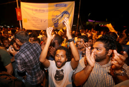 Supporters of Maldivian joint-opposition presidential candidate Ibrahim Mohamed Solih celebrate on the street at the end of the presidential election day in Male, Maldives September 24, 2018. REUTERS/Ashwa Faheem