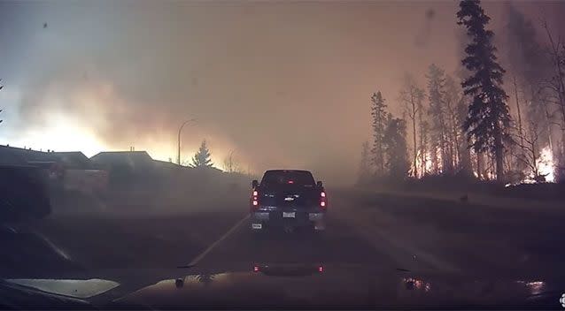 Cars are just metres from fire. Photo: YouTube