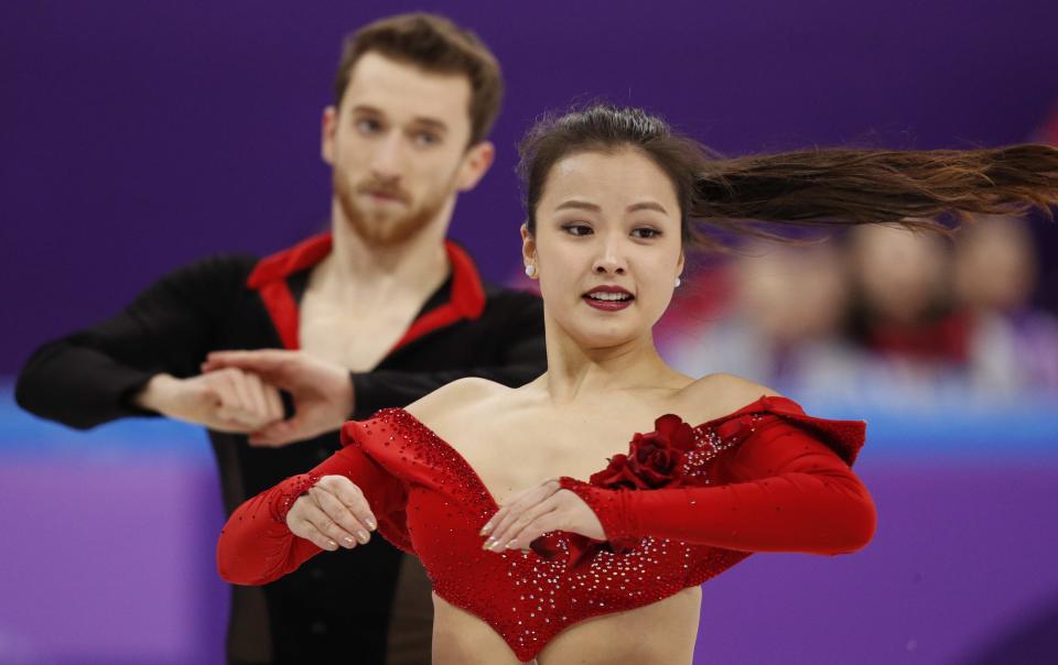 <p>Yura Min and Alexander Gamelin of South Korea compete. REUTERS/John Sibley </p>