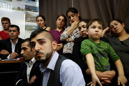 Members of the Tokyo's Kurdish community attend a news conference about recent violence between Turks and Kurds, at a community centre in Tokyo, October 28, 2015. REUTERS/Thomas Wilson