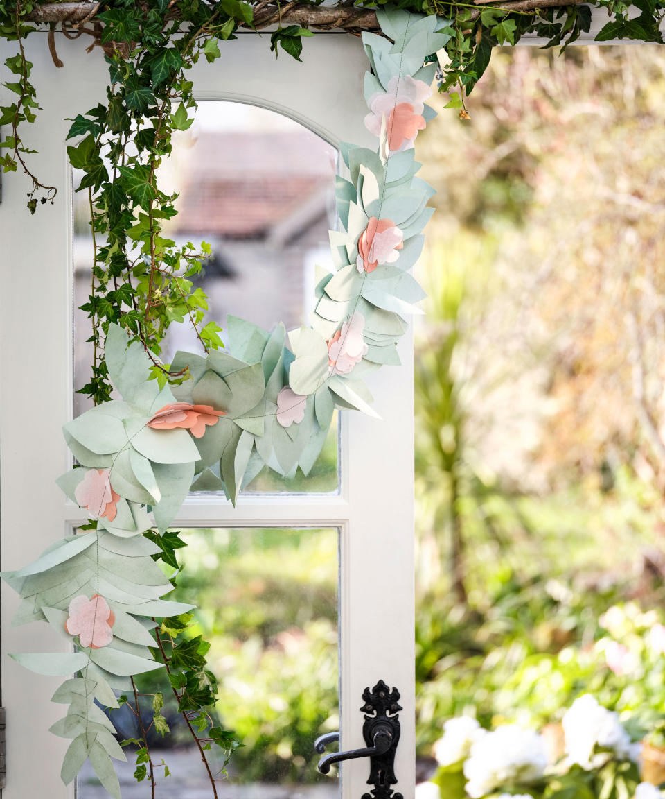 <p> Trim a gazebo or garden room with a pretty paper garland for year-round appeal.&#xA0; </p> <p> <strong>1</strong>. To begin, cut out leaf and blossom shapes from paper and tissue. We cut ours freehand, but for ease try a leaf and flower paper punch, available from all good craft suppliers.&#xA0; </p> <p> <strong>2</strong>. Using a sewing machine, thread up with green cotton and arrange a few leaves in front of the sewing foot, at the leaf base. Slowly start the sewing machine, pushing the paper through under the needle to catch into the stitch. Dot flowers and blossom along the length as needs be and continue until the desired length is reached.&#xA0; </p> <p> <strong>3.</strong>&#xA0;To hang, either drape from garden canes outside or arrange around a window from branches.&#xA0; </p> <p> <strong>Tip</strong>: We added trailing ivy for extra natural leafiness. </p>