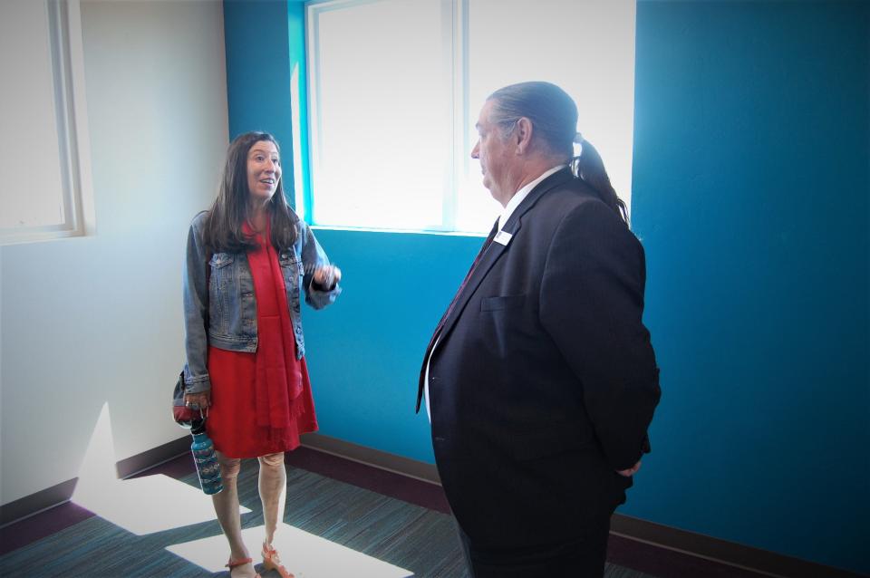 U.S. Rep. Teresa Leger Fernandez speaks with San Juan College Vice President Ed DesPlas on May 5 during a tour of the college's new student housing facility in Farmington.