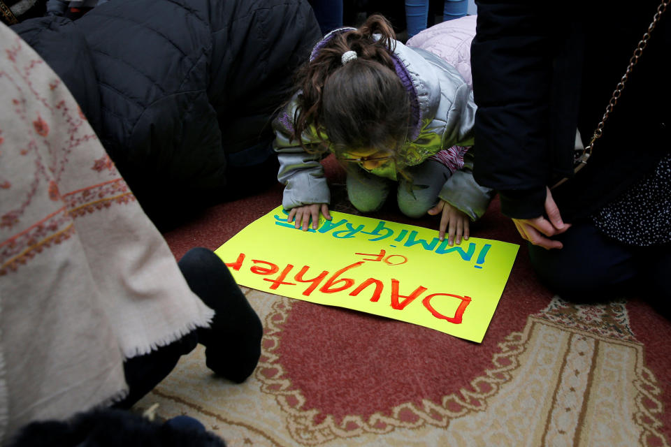 Eight year-old Esma, an Irish-Moroccan-American, prays with other Muslim women during a Boston protest against&nbsp;President Donald Trump's executive order travel ban.