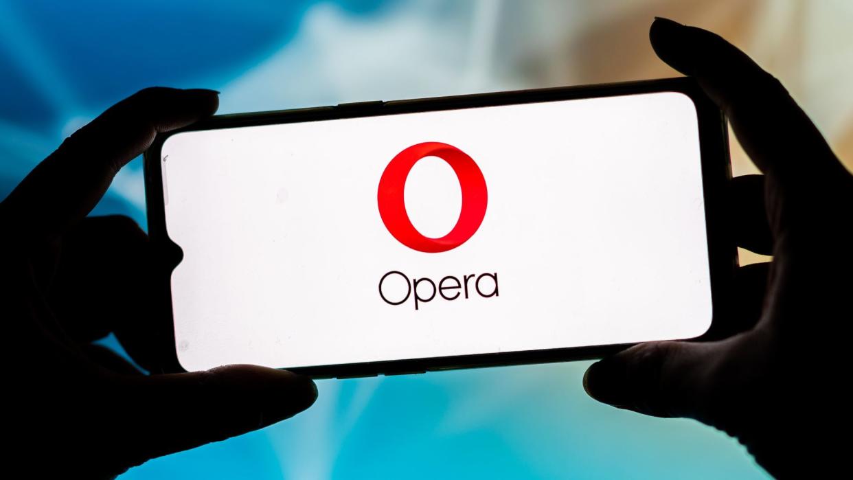  In this photo illustration, an Opera Browser logo seen displayed on a smartphone. . 