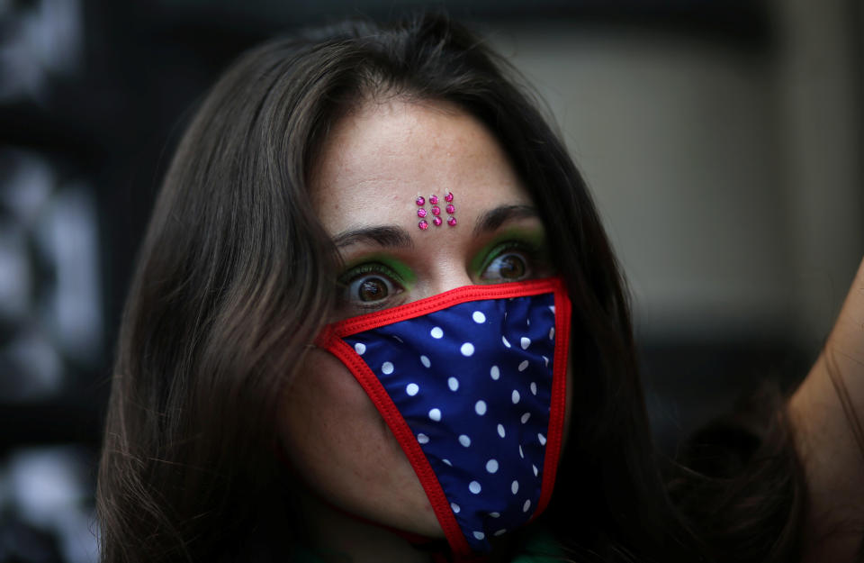 A woman wears knickers as a mask during a demonstration on International Women's Day.