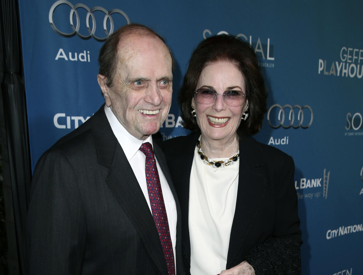 This image released by Geffen Playhouse shows Bob Newhart, left, and Ginnie Newhart backstage at The Geffen Gala in Los Angeles on March 22, 2014. Ginnie Newhart, who was married to comedy legend Bob Newhart for six decades and inspired the classic ending of his “Newhart” series, died Sunday, April 23, 2023, according to Bob's publicist. She was 82. (Matt Sayles/Invision for Geffen Playhouse via AP)