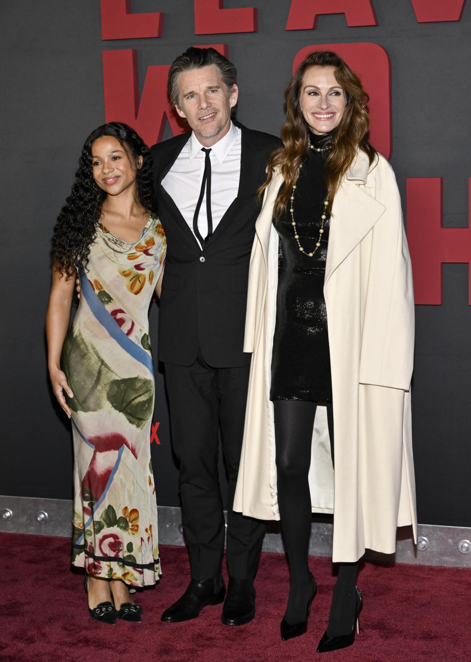 Myha'la Herrold, left, Ethan Hawke, center, and Julia Roberts attend the premiere of Netflix's "Leave the World Behind" at the Plaza Hotel on Monday, Dec. 4, 2023, in New York. (Photo by Evan Agostini/Invision/AP)