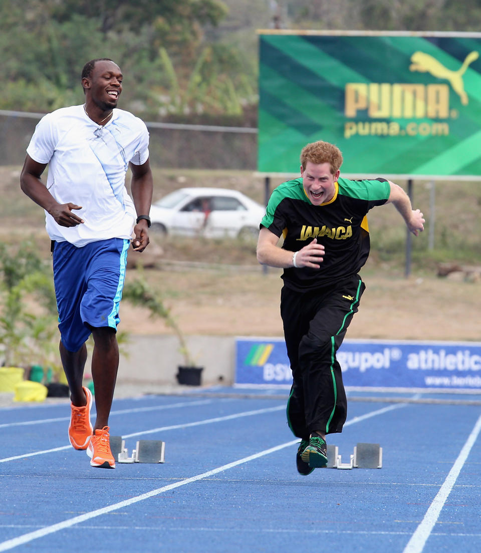 Harry races Usain Bolt at the University of the West Indies on March 6, 2012, in Kingston, Jamaica. (Photo: Chris Jackson via Getty Images)