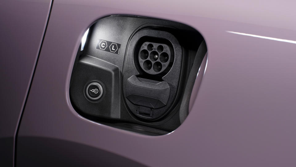 The charging port on an all-electric 2024 Porsche Macan.