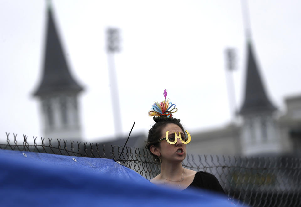 <p>Emily Falco of Denver watches a race before the 144th running of the Kentucky Derby horse race at Churchill Downs Saturday, May 5, 2018, in Louisville, Ky. (Photo: John Minchillo/AP) </p>