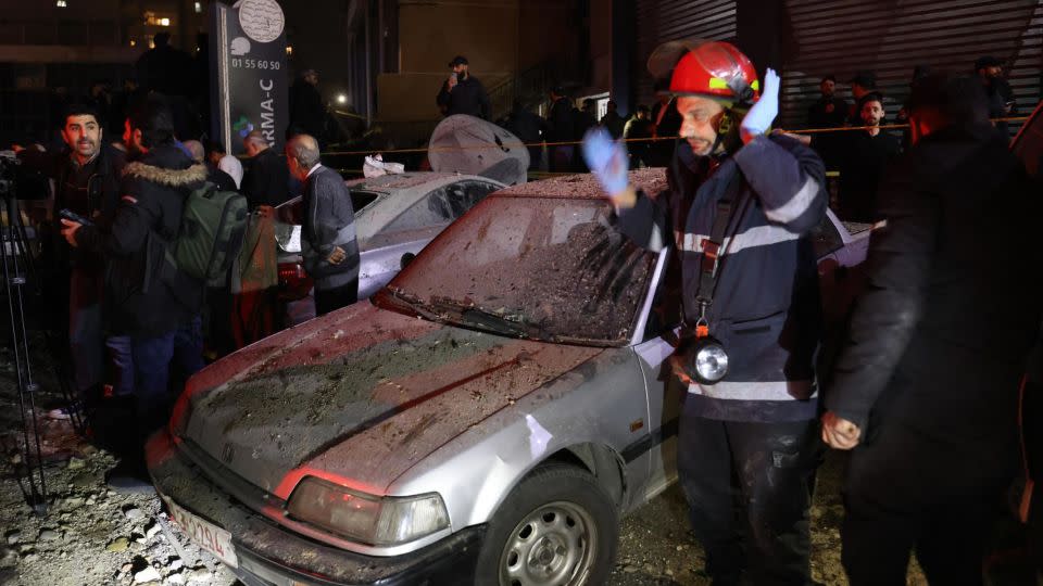 Lebanese emergency responders gather at the site of a strike in the southern suburb of Beirut on January 2, 2024. - Anwar Amro/AFP/Getty Images