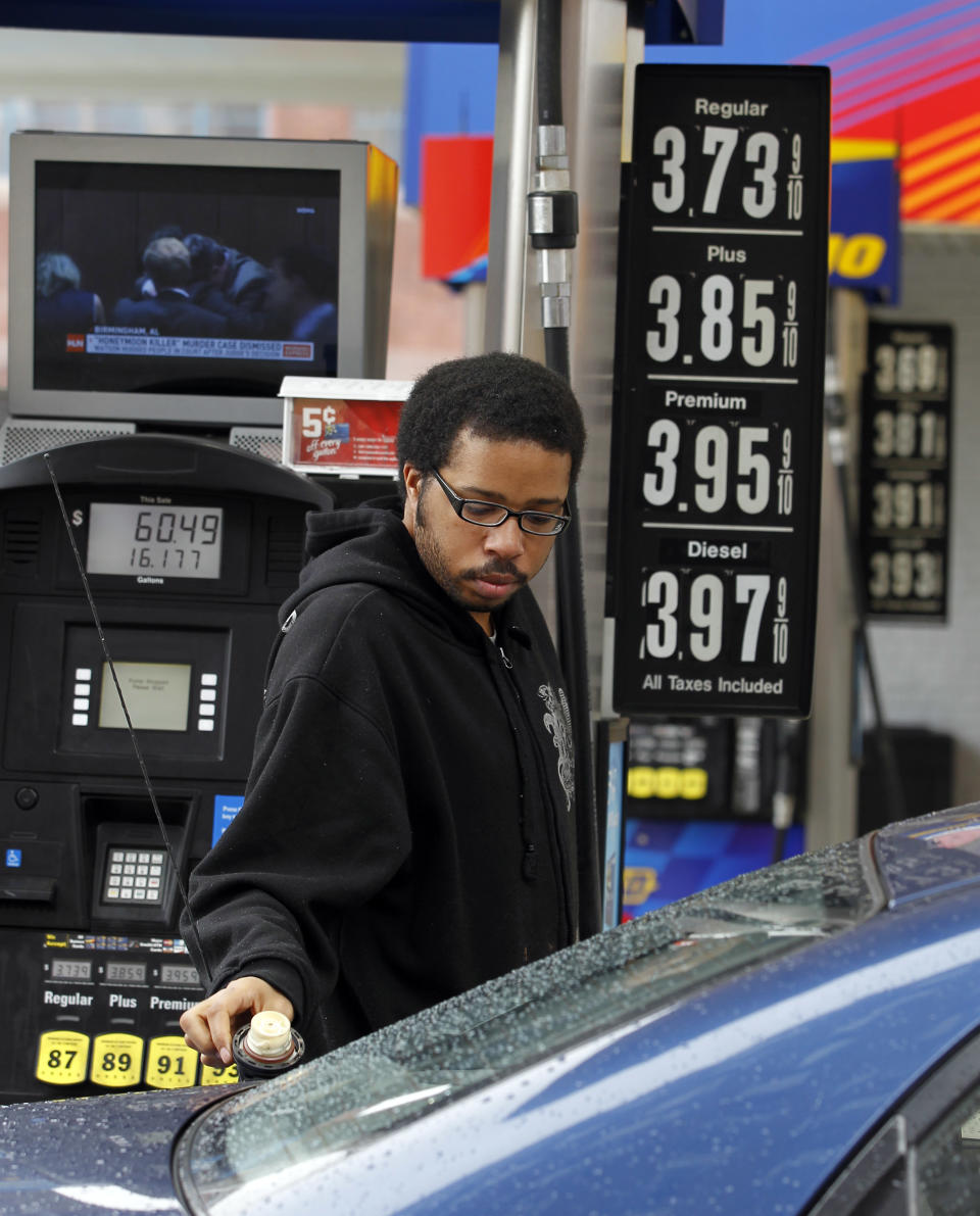 Michael Morris prepares to put gas in his car Friday, Feb. 24, 2012 in Philadelphia. The price of gasoline, which is made from crude oil, has soared as oil prices rise. The national average jumped by nearly 12 cents per gallon in a week, with state averages above $4 per gallon in California, Alaska and Hawaii. (AP Photo/Alex Brandon)