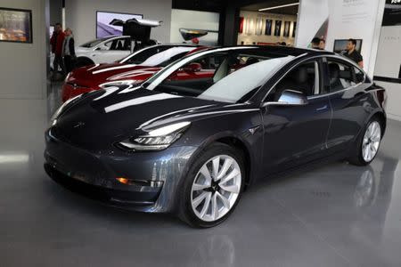 A Tesla Model 3 is seen in a showroom in Los Angeles, California U.S. January 12, 2018. REUTERS/Lucy Nicholson/Files