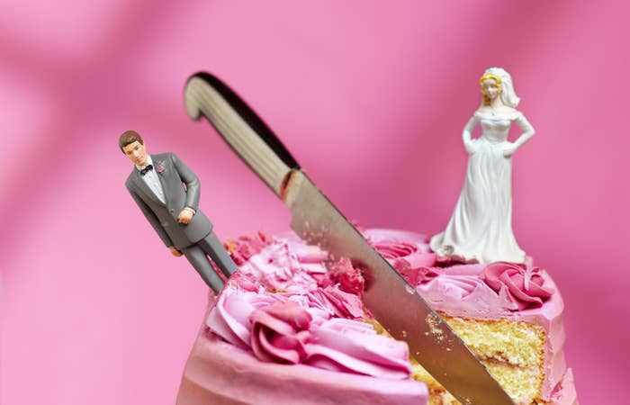 A wedding cake being cut