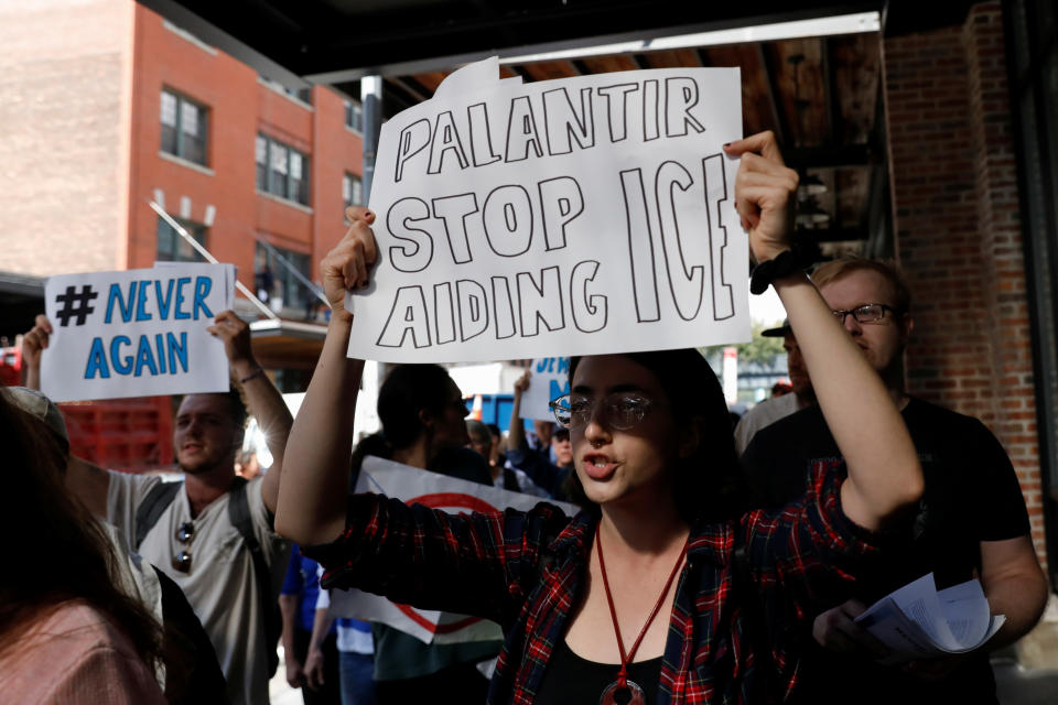 Activists protest outside the Palantir Technologies software company for allegedly helping ICE and the Trump administration in New York City, U.S., September 13, 2019. REUTERS/Shannon Stapleton