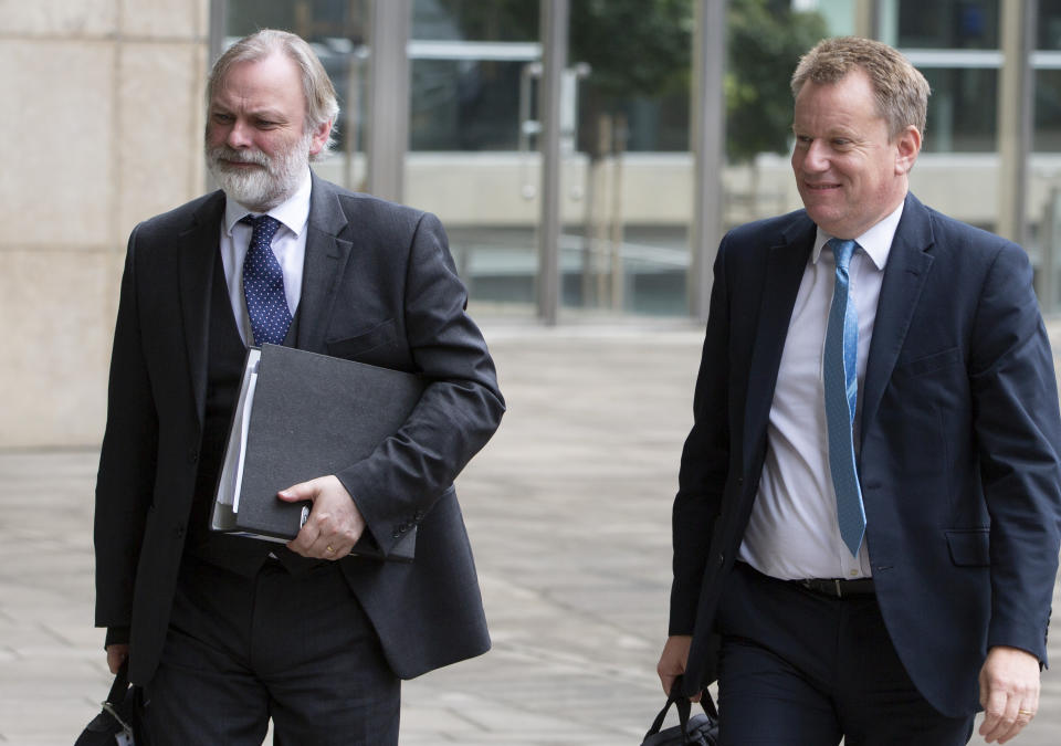 United Kingdom's Brexit advisor David Frost, right, and British Ambassador to the EU Tim Barrow arrive at EU headquarters for a technical meeting on Brexit in Brussels, Wednesday, Sept. 11, 2019. (AP Photo/Virginia Mayo)