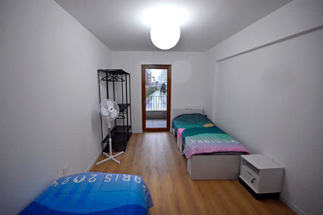 <p>Aurelien Meunier/Getty Images</p> A view of a bedroom of an athlete apartment for the Paris 2024 Olympic Games at the Olympic village