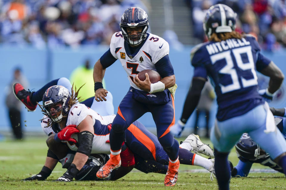 Denver Broncos quarterback Russell Wilson (3) runs out of the pocket against the Tennessee Titans during the first half of an NFL football game, Sunday, Nov. 13, 2022, in Nashville, Tenn. (AP Photo/Mark Humphrey)