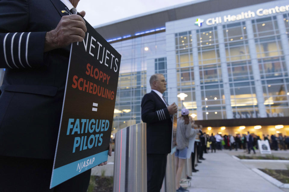 NetJets pilots and their families protest outside the Berkshire Hathaway annual meeting on Saturday, May 6, 2023, in Omaha, Neb. (AP Photo/Rebecca S. Gratz)