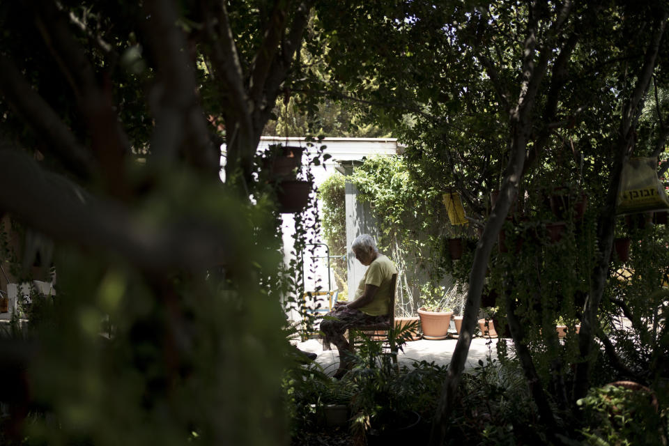 Judith Tzamir, a Holocaust survivor from Germany, speaks to a journalist in her family home in Kibbutz Meflasim, southern Israel, Friday, May 3, 2024. On Monday, Tzamir will join 55 other Holocaust survivors from Israel and around the world for a memorial march in Poland, called March of the Living. (AP Photo/Maya Alleruzzo)