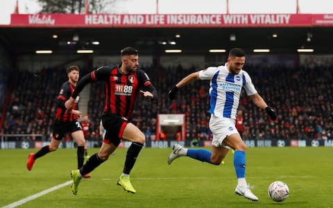 Brighton's Florin Andone in action with Bournemouth's Diego Rico - Credit: REUTERS