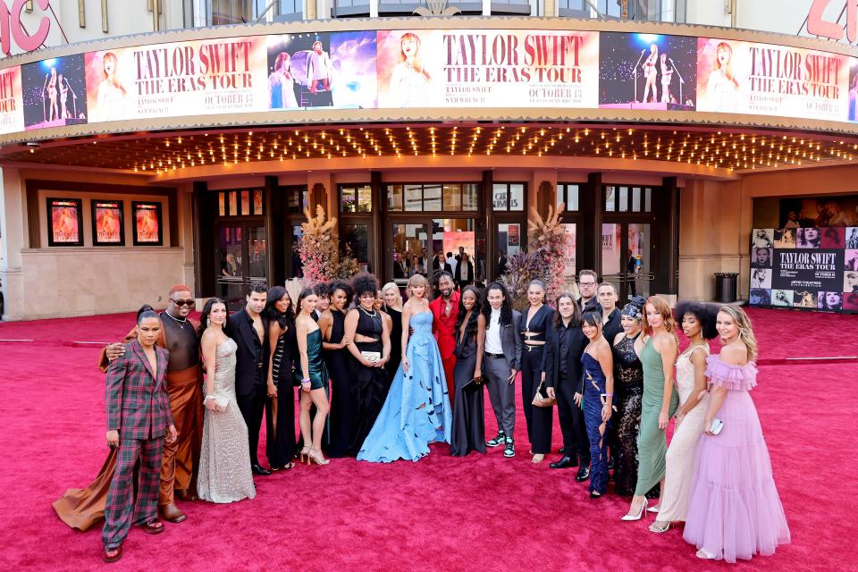 Taylor Swift (center) and her Eras Tour dancers, band members and backup singers arrive at the world premiere of the concert film "Taylor Swift: The Eras Tour" on Oct. 11, 2023, at The Grove in Los Angeles.