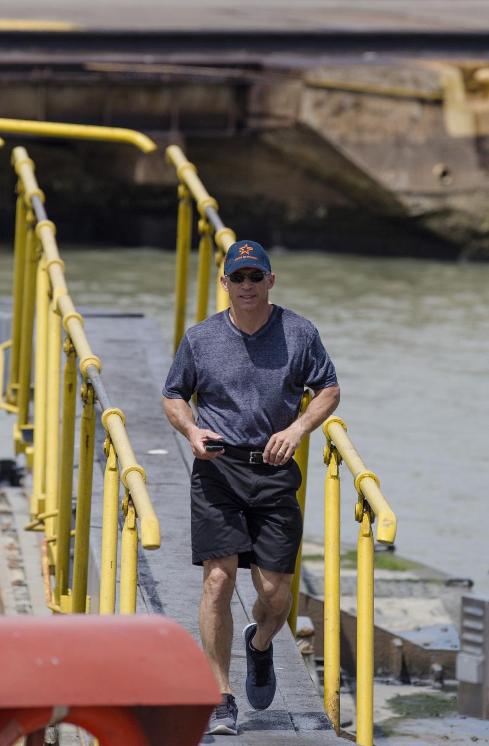 Joe Girardi manager of New York Yankees walks across the the Miraflores Locks at the Panama Canal in Panama City, Friday, March 14, 2014. The New York Yankees and the Miami Marlins will play on March 15-16, in the "Legend Series" to honor recently retired Yankees pitcher Mariano Rivera. (AP Photo/Tito Herrera)