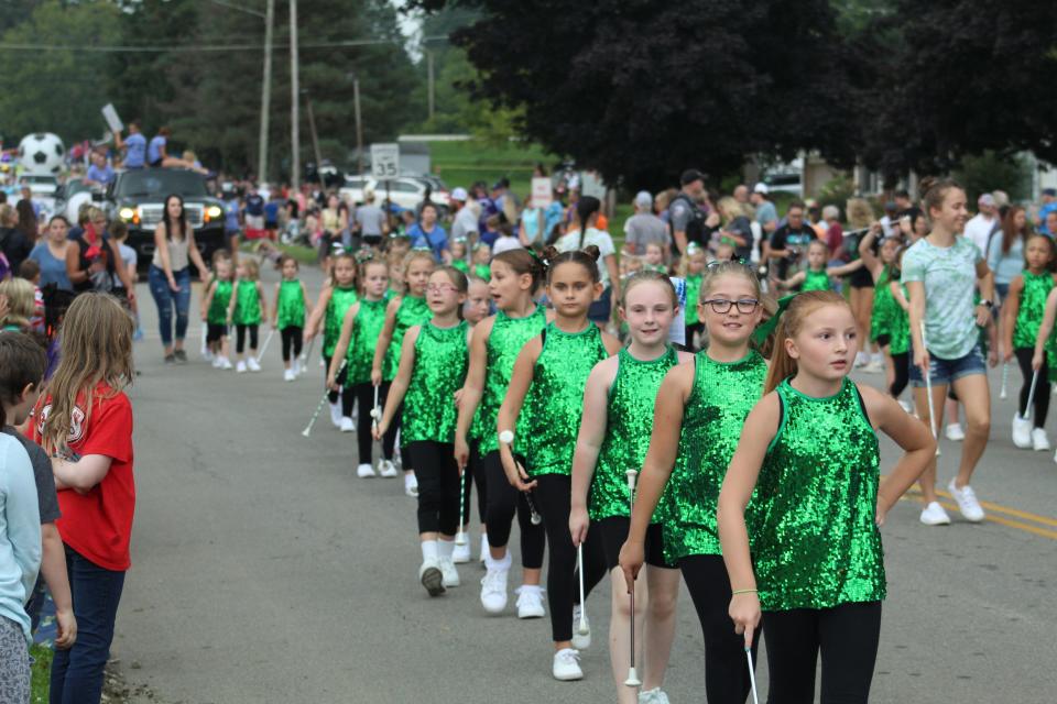 A group of baton twirlers take part in the 2022 Lexington Blueberry Festival Parade.