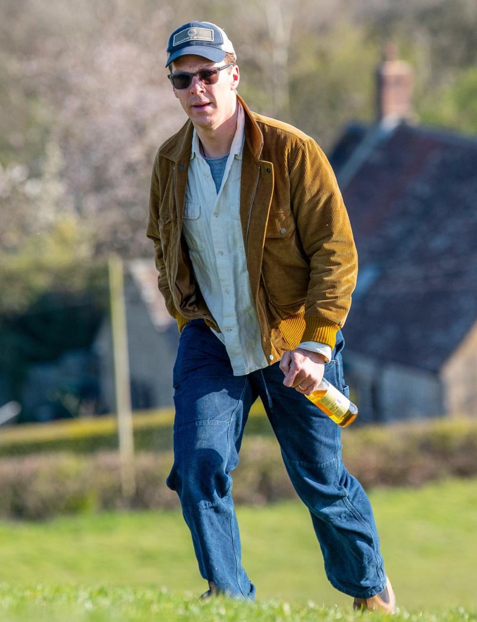 <p>Benedict Cumberbatch enjoys a bottle of cider on Burrow Hill in Somerset after the final day of filming <em>Doctor Strange</em> on Saturday.</p>