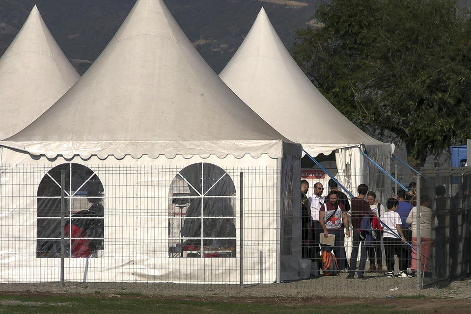 In this image taken from video, refugees from the first group of about 30 people from Nagorno-Karabakh gather in a temporary camp after arriving to Armenia's Kornidzor village in Syunik region, Armenia, Sunday, Sept. 24, 2023. The first refugees from Nagorno-Karabakh have arrived in Armenia, local officials reported Sunday, and more were expected to come after a 10-month blockade and a lightning military offensive this month that resulted in Azerbaijan reclaiming full control of the breakaway region. (AP Photo)