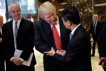 U.S. President-elect Donald Trump shakes hands with and Alibaba Executive Chairman Jack Ma after their meeting at Trump Tower in New York, U.S., January 9, 2017. REUTERS/Mike Segar