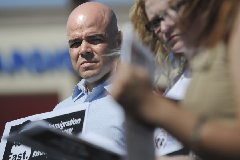 In this March 24, 2014, file photo, Immigration Reform for Nevada supporter Robert Telles is seen during an event outside the office of U.S. Rep. Joe Heck, R-Nev., in protest of Congress not taking action on comprehensive immigration reform. Police say they are serving search warrants in connection with the fatal stabbing of a Las Vegas newspaper reporter last week. In a statement Wednesday, Sept. 7, 2022 Metro Police didn't specify where they were searching in connection with the death of reporter Jeff German. But the Las Vegas Review-Journal reported uniformed officers and police vehicles were seen outside the home of Clark County Public Administrator Robert Telles (Erik Verduzco/Las Vegas Review-Journal via AP)