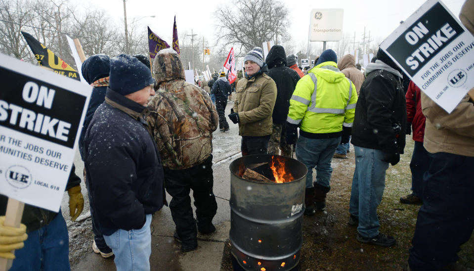 Wabtec Corp. employees, who are members of UE Local 506, strike near the west gate of the former GE Transportation plant, now owned by Westinghouse Airbrakes Technologies Corp., in Lawrence Park Township, Erie County, Pa., on Tuesday, Feb. 26, 2019. Leaders of UE Locals 506 and 618 said in a statement that they were unable to convince the company to negotiate what they called an "acceptable short term agreement that preserves the wages, benefits, and working conditions" for more than 1,000 employees. (Greg Wohlford/Erie Times-News via AP)