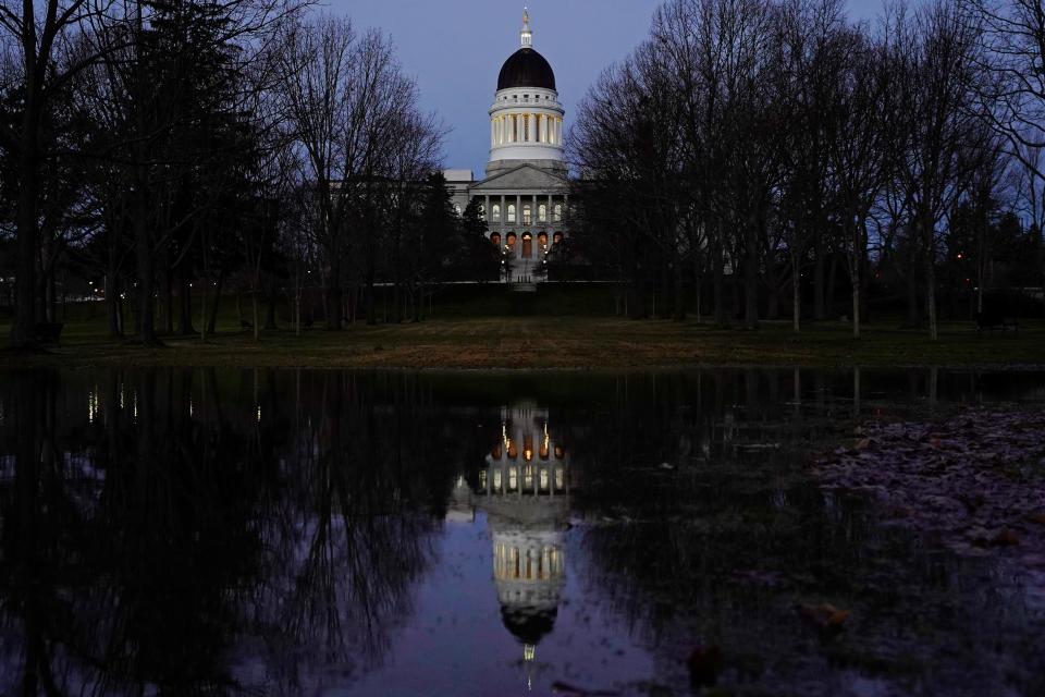 The Maine State House is seen at dawn from Capitol Park on Dec. 2, 2020, in Augusta, Maine. Democratic leaders in the Maine Legislature were prepared Thursday, March 30, 2023, to push through a $9.8 billion, two-year state budget that’ll ensure there’s no government shutdown this summer.